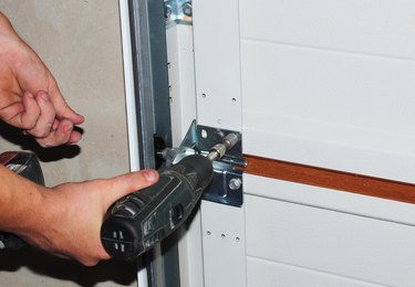 Contractor repair and replace garage door. Garage door installation.