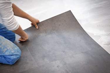 Worker making vinyl flooring