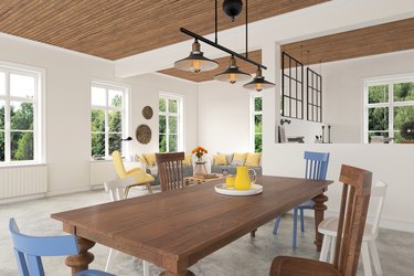 Wooden dining table with chairs close up