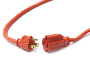 Both ends of an orange power cable