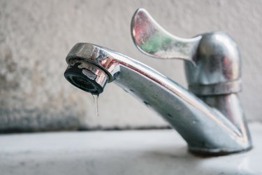 Close-Up Of Water Dripping From Faucet