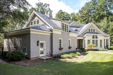 Front view of large cape cod style home with custom feautures