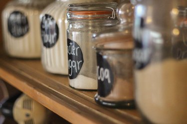 Close up of kitchen pantry with jars of spices