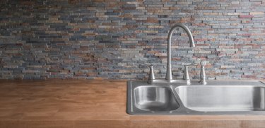 Wood Kitchen counter and stone backsplash tiles