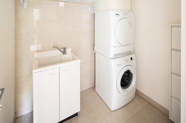 Laundry room with modern washer and dryer