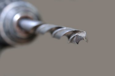 Steel plumbing drill. Variety of tools and instruments close-up.