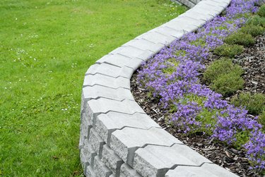 White granite garden ornament with flowers inside