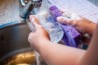 Woman Hand-Washing Dishes