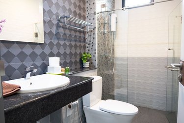 Modern bathroom interior with white toilet and shower