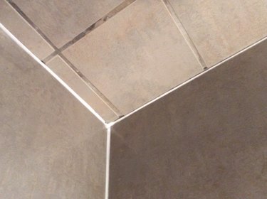 Fresh caulk on shower tile