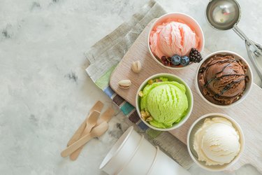 Selection of colorful ice cream scoops in paper cones