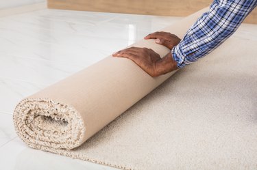 Worker's Hands Rolling Carpet