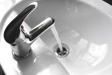 Faucet with Running Water in a Sink