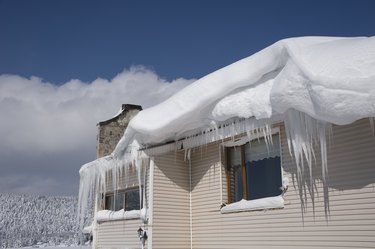 Snow, icicles and ice dam on roof.