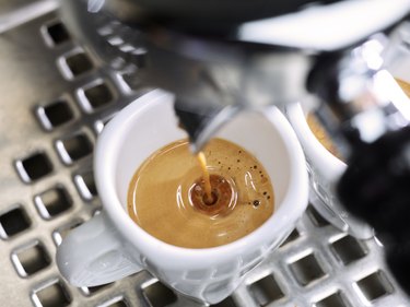 Espresso flowing into an espresso cup
