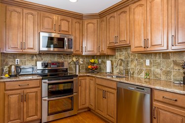 Kitchen with mocha wood cabinetry