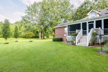 Back of Colonial Brick House with Landscaped Yard