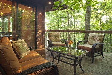 Deck with outdoor furniture in wooded setting