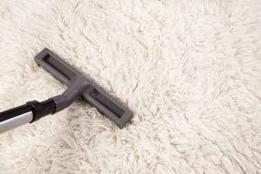 Vacuum cleaner nozzle on shag carpet