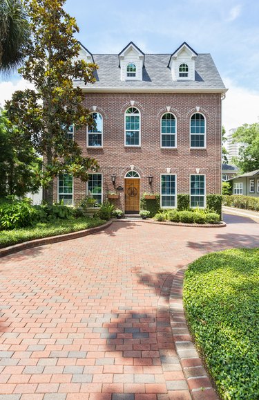 Colonial Style Home with a Brick Paver Driveway