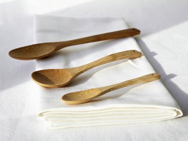 Wooden spoons on folded napkin