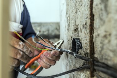 Photo of Hand striping the insulation of wires