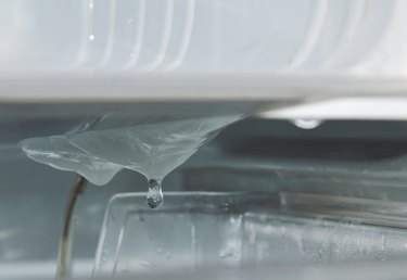 Water dripping from ice in refrigerator while defrost and cleaning