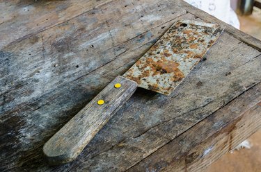 Old Rusty Kitchen Knife on dirty table
