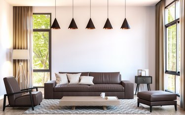 Modern living room decorate with  brown leather furniture 3d rendering image