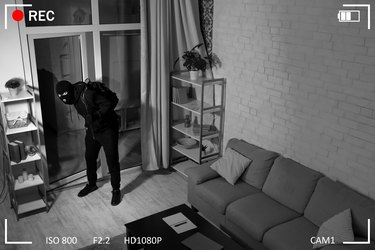 Thief With Crowbar Entering Into House View From Camera