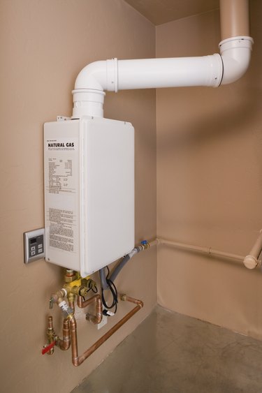 Tankless water heater attached wall.