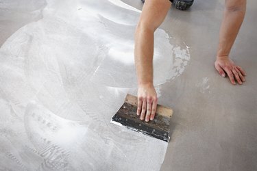 Worker making vinyl flooring