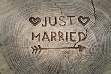 Woodcarving. Newlyweds, Just married, inscription on the wedding. Background