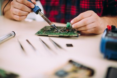 Close-up of motherboard in process of repare