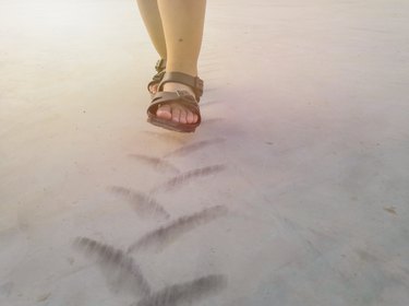 Children are walking on Tire tread pattern on concrete floor.Happy time.