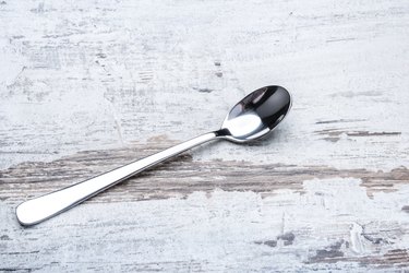 Long macchiato silver spoon on the table