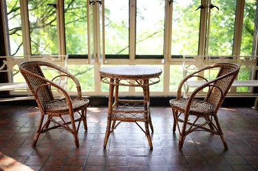 Old Wicker Bistro Table and Chairs in Sun Room Patio of Historic House