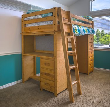 Wooden bunk bed in child's bedroom