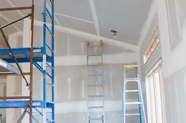 Drywall Taping, Scaffold, and Ladders in New Home Under Construction