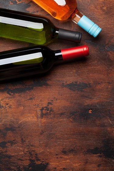 Various wine bottles on wooden table