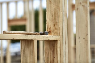 Hammer laying on a 2X4