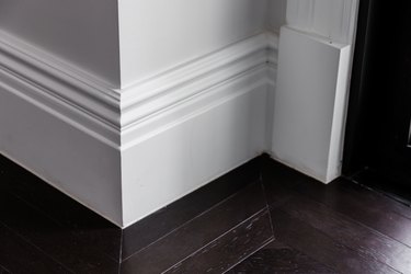 Baseboard molding and wood floor