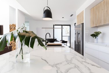 Kitchen bench close up with black hanging pendant