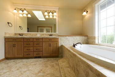 Luxury bathroom with travertine floors