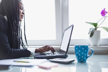 Woman working at home.