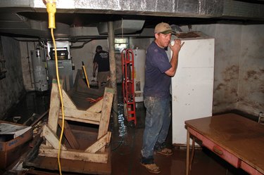 Cleaning up flooded basement.