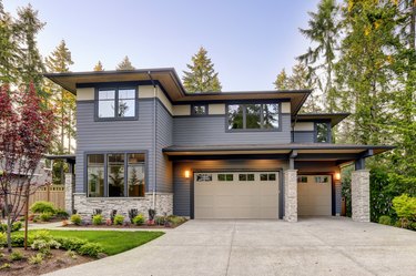 New construction home with wood and stone siding