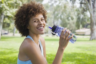 Woman holding a water bottle
