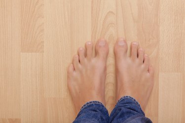 Bare feet on floor.
