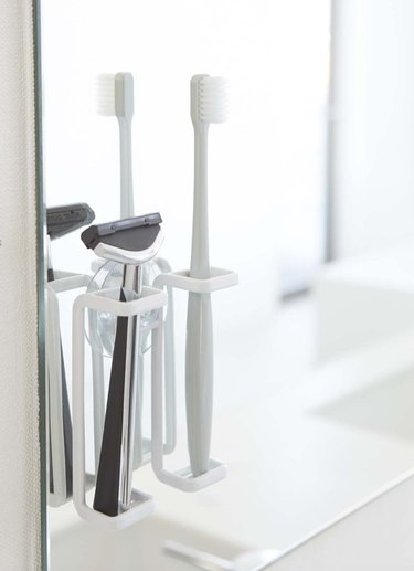 Medicine Cabinet Organization ideas with Razor and toothbrush holder
